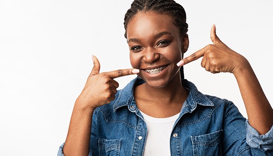a patient with braces smiling