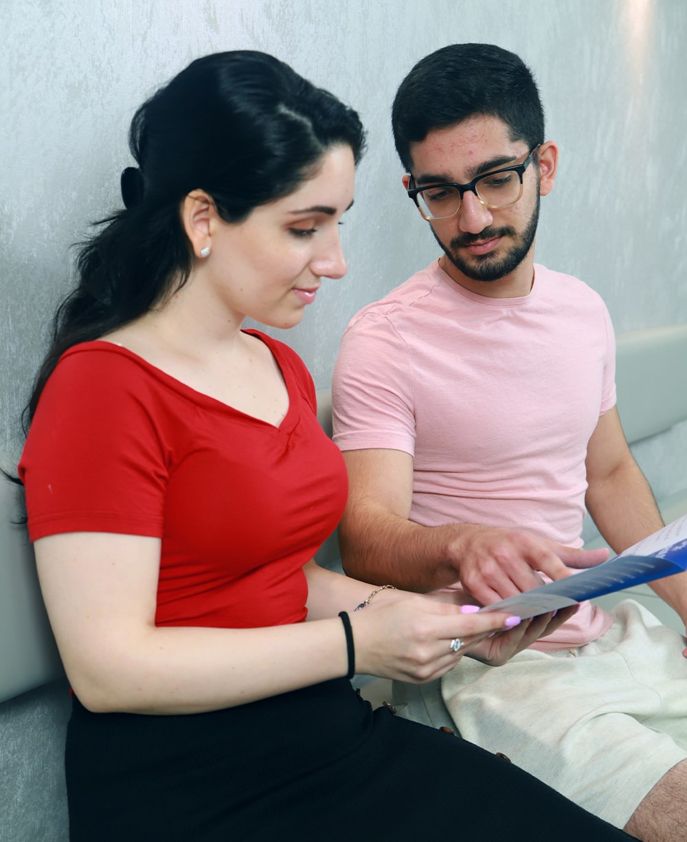 Orthodontic team member and patient reviewing payment and discount options