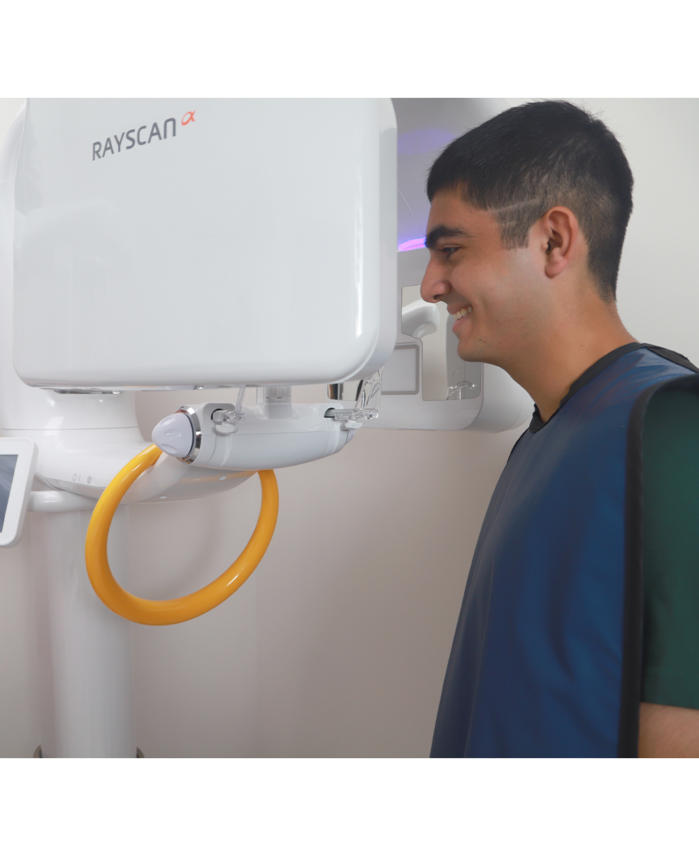 Orthodontic patient getting ready for 3 D C T cone beam x-ray scans