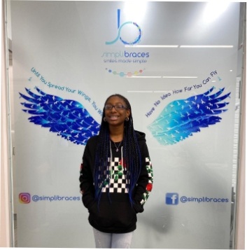 Young girl smiling in orthodontic office in Queens