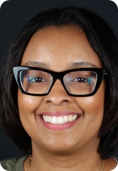 Smiling female orthodontic patient in Queens