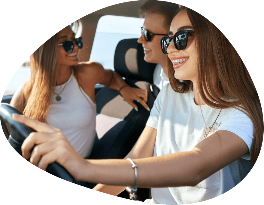 Three smiling teens enjoying life with braces