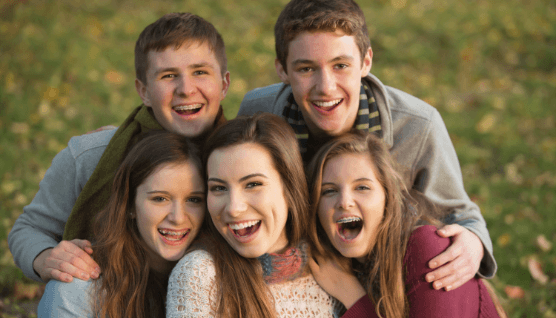 Smiling group of people with different types of braces