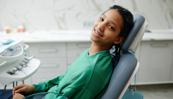 Teenager relaxing in dental treatment chair