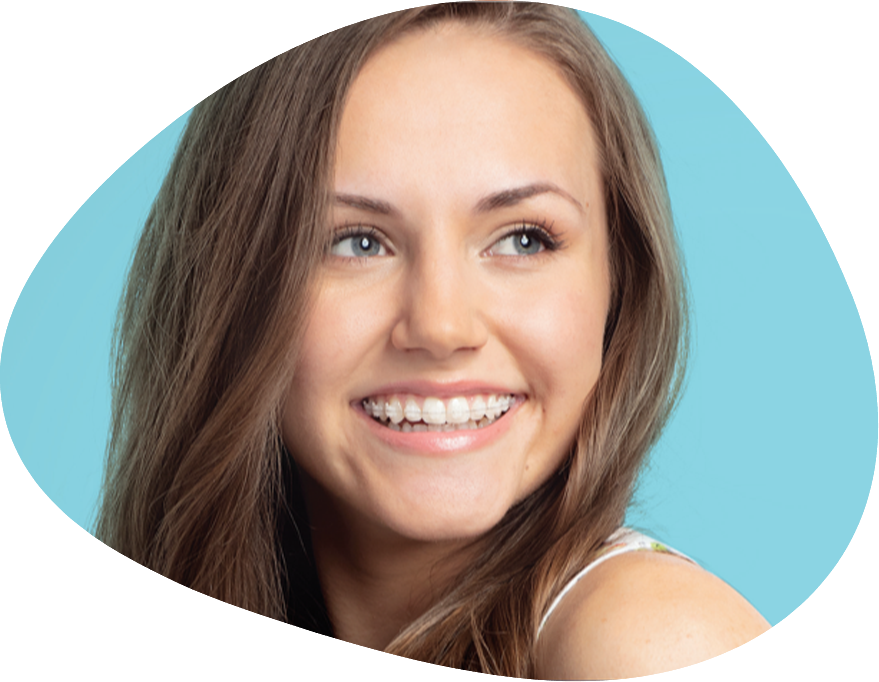 Smiling teen girl with traditional orthodontics