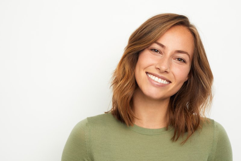 woman smiling while wearing hidden braces