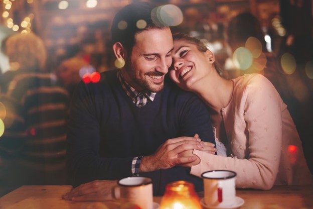 young couple on date embracing