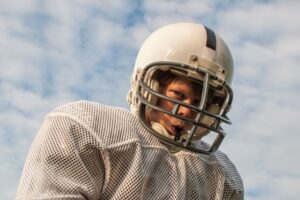 Teenage football player wearing a mouthguard
